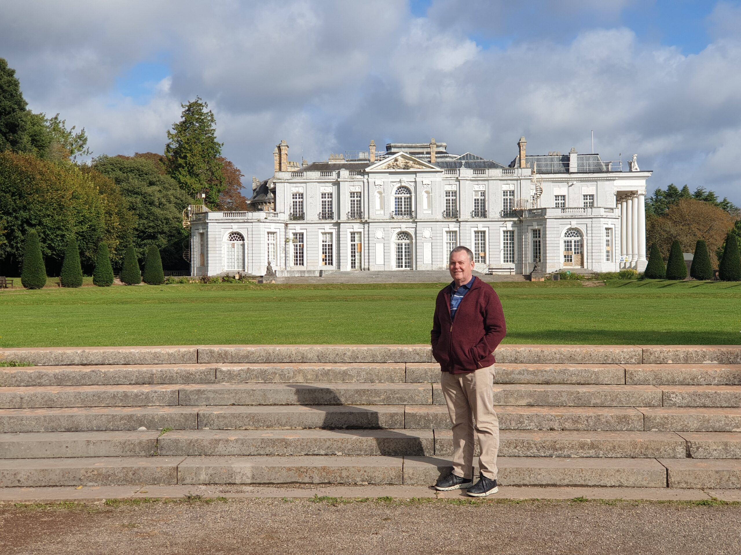 Man standing in front of abandoned Singer family home – Oldway Mansion